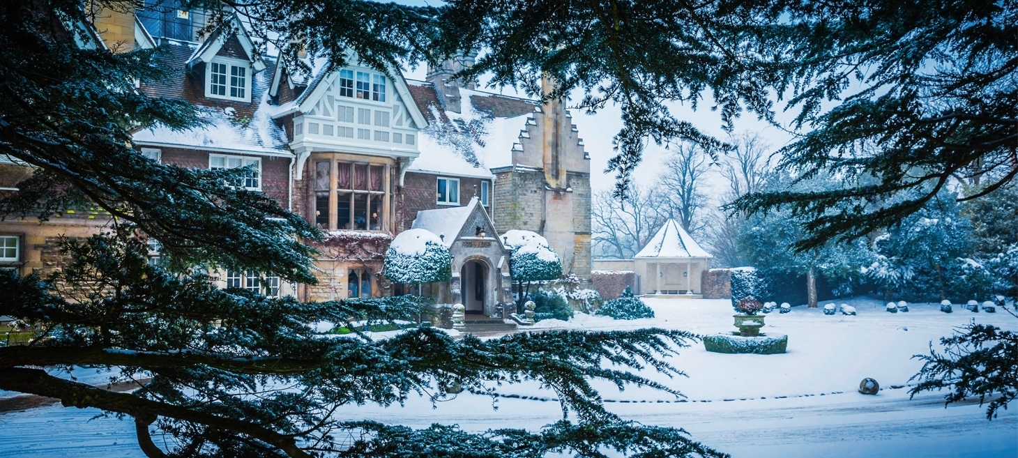Hambleton Hall in winter with snow outside and on the building